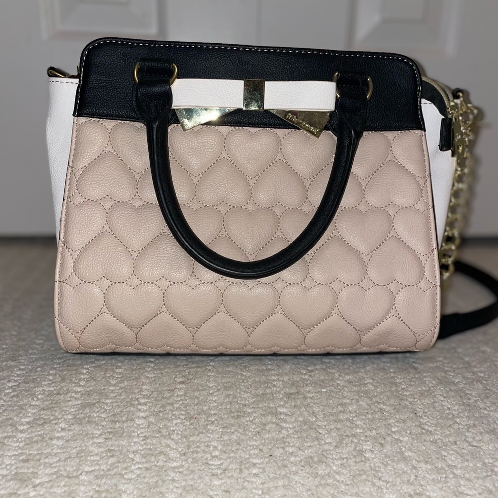 Betsy Johnson purse 
Light pink and black.